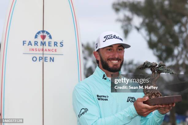 Max Homa of the United States celebrates with the trophy after winning the Farmers Insurance Open on the South Course of Torrey Pines Golf Course on...