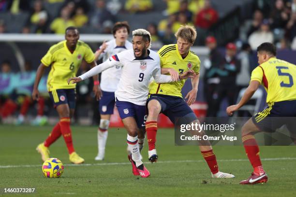 Jesús Ferreira of United States and Andrés Llinás of Colombia battle for the ball during the international friendly match between United States and...