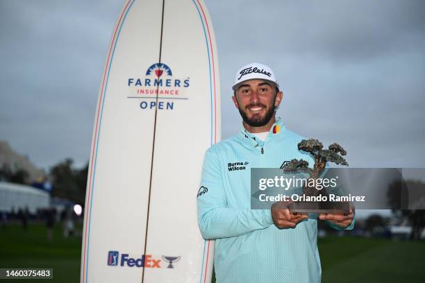 Max Homa of the United States celebrates with the trophy after winning the Farmers Insurance Open on the South Course of Torrey Pines Golf Course on...