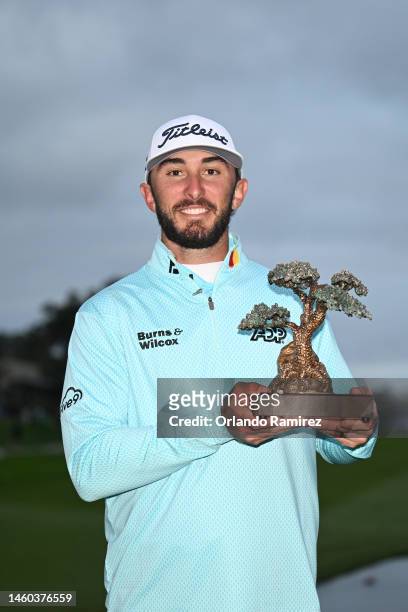 Max Homa of the United States celebrates with the trophy after winning the Farmers Insurance Open on the South Course of Torrey Pines Golf Course on...