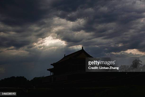 After the rain Tiananmen Gate is seen under the sunset on June 9, 2012 in Beijing, China. A candlelit vigil was held in Hong Kong night to...