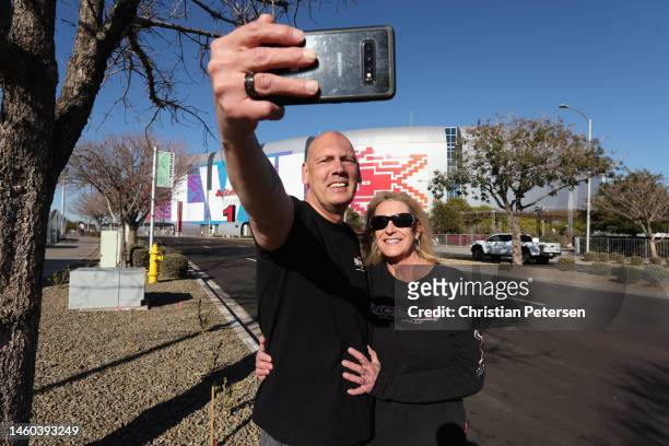 Kurt Schafer and Julie Googins pose for a selfie outside of State Farm Stadium on January 28, 2023 in Glendale, Arizona. State Farm Stadium will host...
