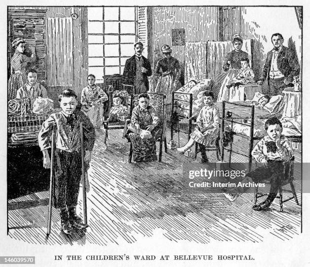 Scene in the children's ward at Bellevue Hospital, showing children, some on crutches or with legs in casts, and nurses in the room, New York City,...