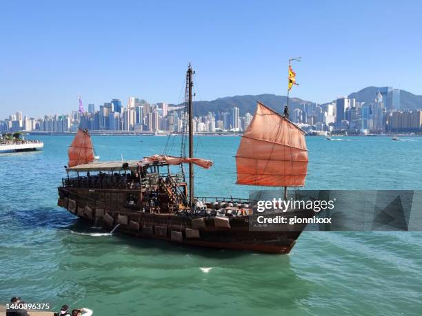 junk boat on victoria harbour, hong kong - junk ship stock pictures, royalty-free photos & images