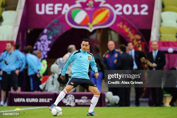 Xavi Hernandez of Spain controles the ball during a UEFA EURO 2012 training session ahead of their Group C match against Italy at the Municipal...