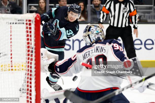 Elvis Merzlikins of the Columbus Blue Jackets makes a save on a shot from Yanni Gourde of the Seattle Kraken during the second period at Climate...