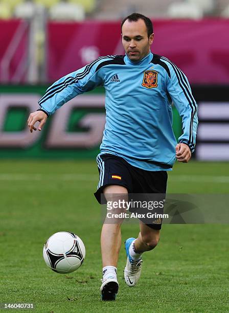 Andres Iniesta of Spain controles the ball during a UEFA EURO 2012 training session ahead of their Group C match against Italy at the Municipal...