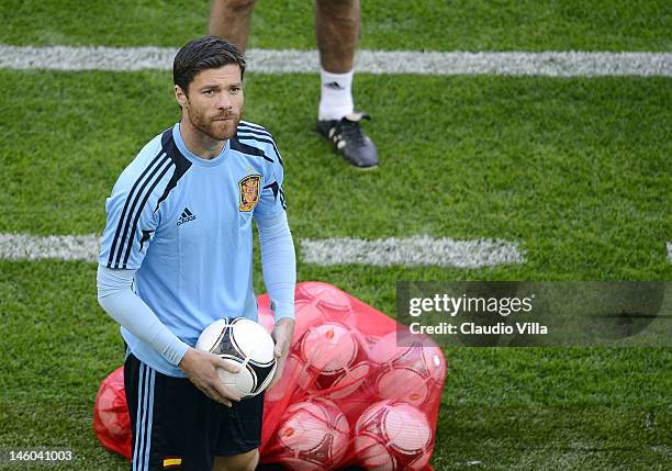 Xabi Alonso of Spain during a training session ahead of the UEFA EURO 2012 Group C match against Italy at the Municipal Stadium on June 9, 2012 in...