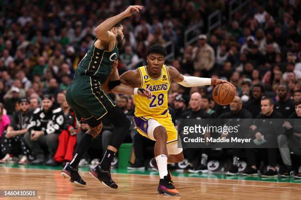Rui Hachimura of the Los Angeles Lakers dribbles against Jayson Tatum of the Boston Celtics during the second half at TD Garden on January 28, 2023...