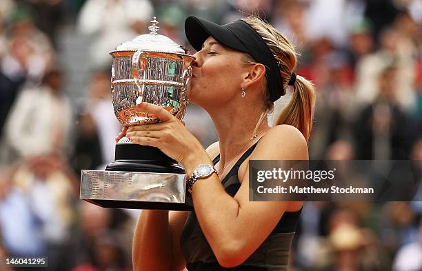 Maria Sharapova of Russia kisses the Coupe Suzanne Lenglen after the women's singles final against Sara Errani of Italy during day 14 of the French...