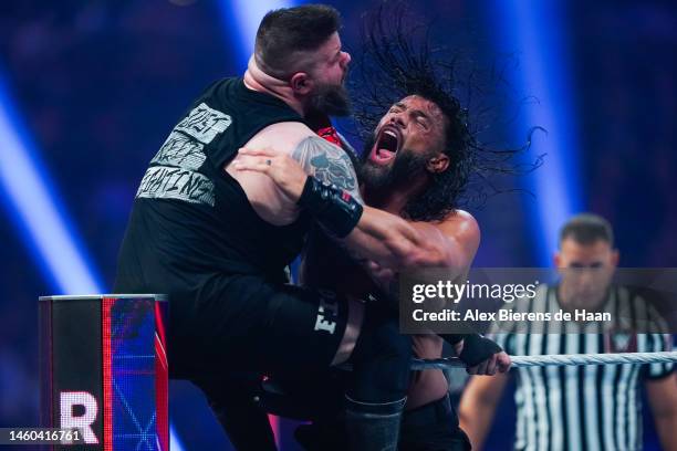 Roman Reigns and Kevin Owens wrestle during the WWE and Universal Championship match during the WWE Royal Rumble event the Alamodome on January 28,...