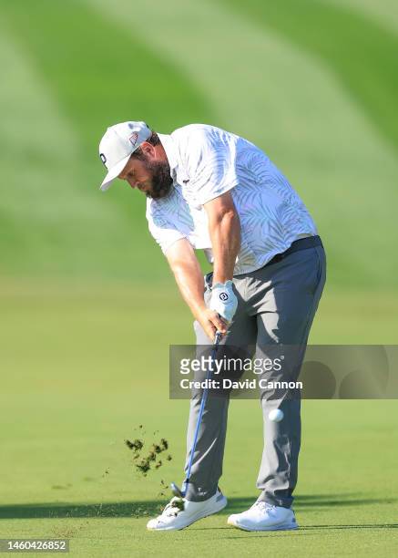 Andrew Johnsto of England plays his second shot on the first hole during the delayed third round on Day Four of the Hero Dubai Desert Classic on the...