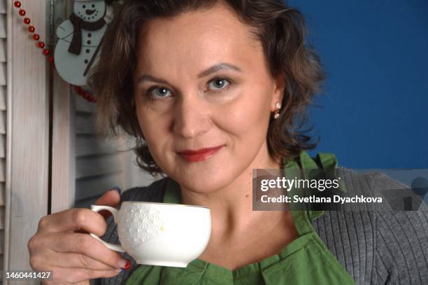 portrait of a housewife girl drinking tea portrait housewife girl drinking tea