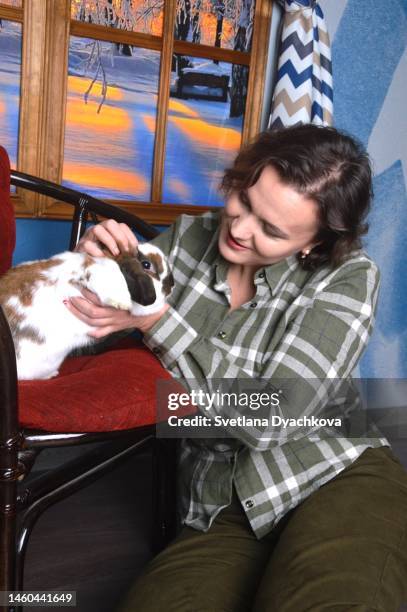 portrait of a girl holding a rabbit portrait girl holding rabbit