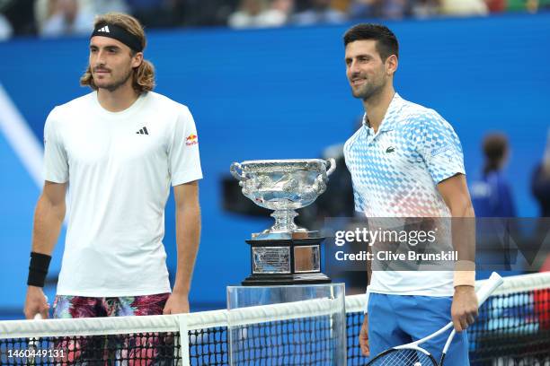 Stefanos Tsitsipas of Greece and Novak Djokovic of Serbia pose with the Norman Brookes Challenge Cup in the Men’s Singles Final during day 14 of the...