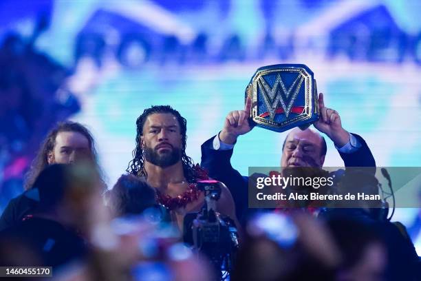 Roman Reigns and Paul Heyman walk into the arena prior to the WWE and Universal Championship match during the WWE Royal Rumble at the Alamodome on...