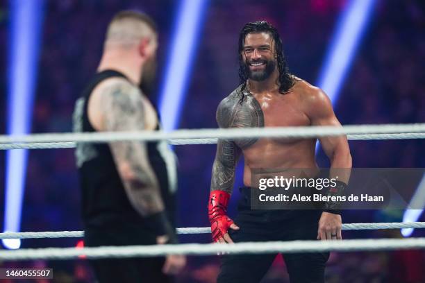 Roman Reigns and Kevin Owens wrestle during the WWE and Universal Championship match during the WWE Royal Rumble event at the Alamodome on January...