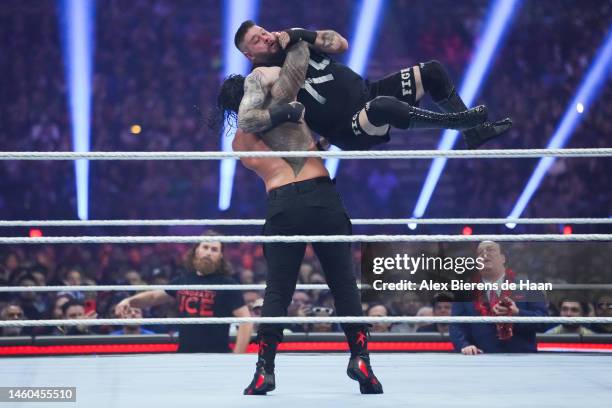 Roman Reigns and Kevin Owens wrestle during the WWE and Universal Championship match during the WWE Royal Rumble event at the Alamodome on January...