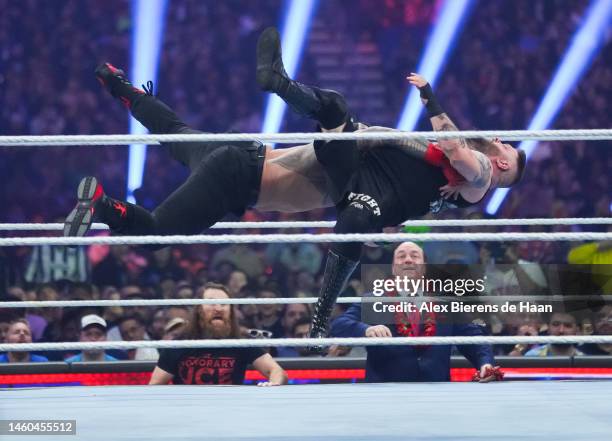 Roman Reigns and Kevin Owens wrestle during the WWE and Universal Championship match during the WWE Royal Rumble event at the Alamodome on January...