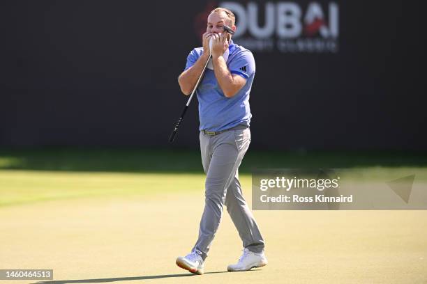 Tyrell Hatton of England reacts on the 18th green during the Third Round on Day Four of the Hero Dubai Desert Classic at Emirates Golf Club on...