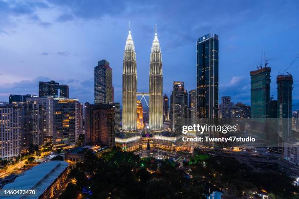 kuala lumpur skyscrapers petronas twin towers the iconic of malaysia - kuala lumpur night stock pictures, royalty-free photos & images