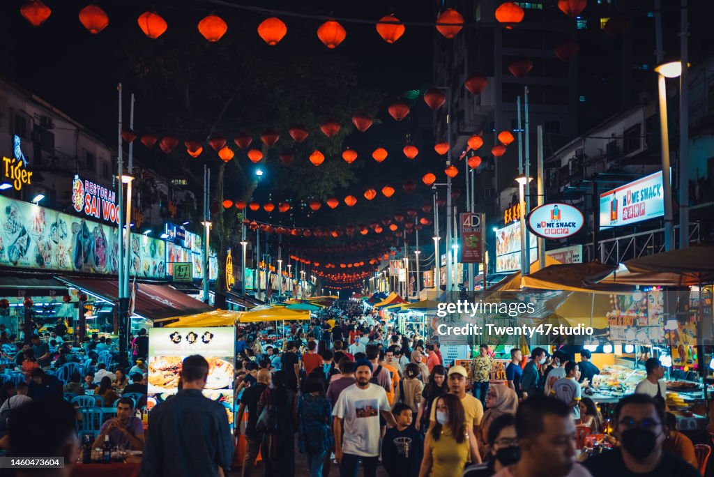 Crowd of people walking in Jalan Alor food street is a popular tourist attraction in Kuala Lumpur city center