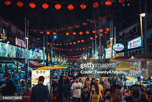 Crowd of people walking in Jalan Alor food street is a popular tourist attraction in Kuala Lumpur city center Crowd of people walking in Jalan Alor food street is a popular tourist attraction in Kuala Lumpur city center