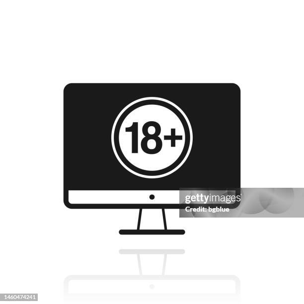 desktop computer with eighteen plus sign (18+). icon with reflection on white background - under attack stock illustrations