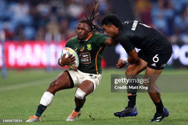 Darren Adonis of South Africa is tackled during the 2023 Sydney Sevens match between New Zealand and South Africa at Allianz Stadium on January 29,...