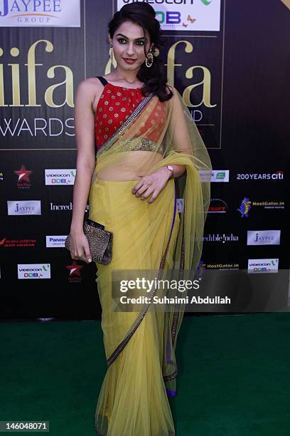 Bollywood actress Andrea Jeremiah poses at the IIFA green carpet event at the 2012 International India Film Academy Awards at the Singapore Indoor...