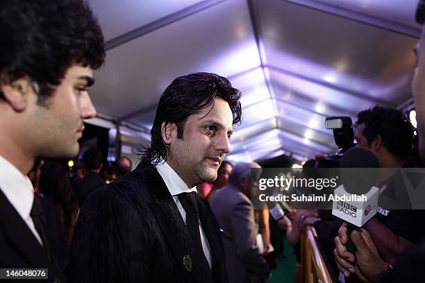 Indian actor Fardeen Khan speaks to the media at the IIFA green carpet event at the 2012 International India Film Academy Awards at the Singapore...