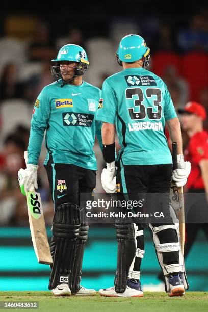 Usman Khawaja of the Heat and Marnus Labuschagne of the Heat look on during the Men's Big Bash League match between the Melbourne Renegades and the...