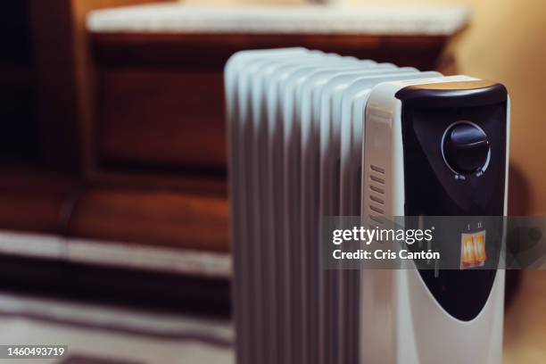 electric radiator in home room - lareira elétrica imagens e fotografias de stock
