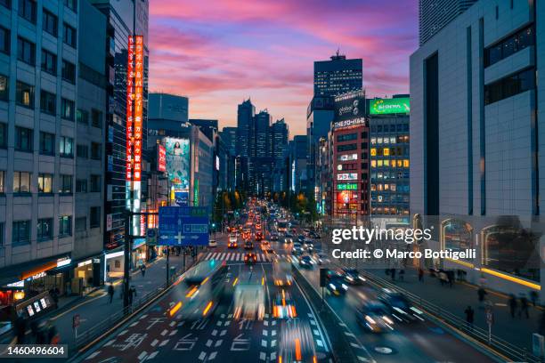 busy urban roads at dusk in tokyo - pedestrian street stock pictures, royalty-free photos & images