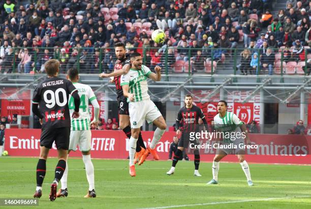 Olivier Giroud of AC Milan jumps for the ball during the Serie A match between AC MIlan and US Sassuolo at Stadio Giuseppe Meazza on January 29, 2023...
