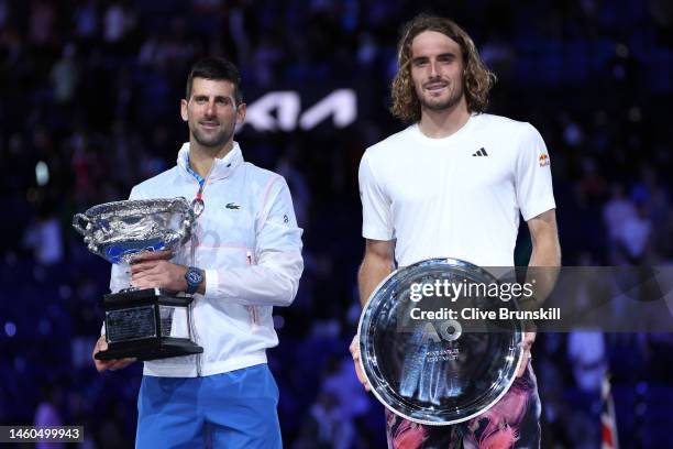 Novak Djokovic of Serbia poses with the Norman Brookes Challenge Cup alongside Stefanos Tsitsipas of Greece after the Men's Singles Final match...