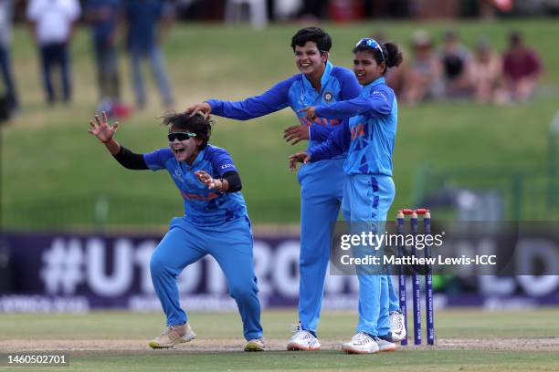 Shafali Verma of India celebrates the wicket of Hannah Baker of England with team mates Hrishita Basu and Archana Devi during the ICC Women's U19 T20...