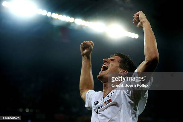 Mario Gomez of Germany celebrates scoring their first goal during the UEFA EURO 2012 group B match between Germany and Portugal at Arena Lviv on June...