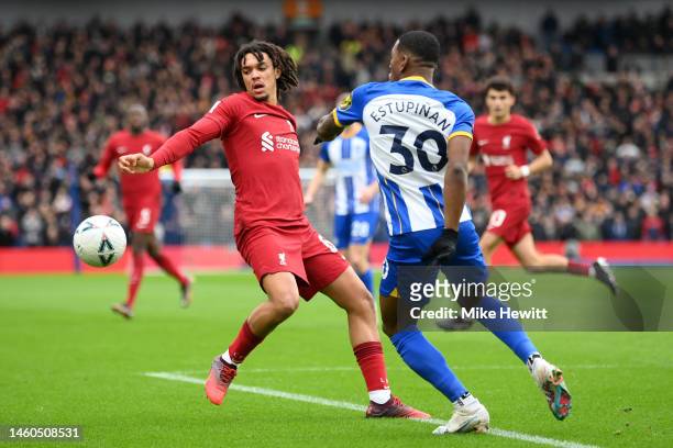 Trent Alexander-Arnold of Liverpool battles for possession with Pervis Estupinan of Brighton & Hove Albion during the Emirates FA Cup Fourth Round...