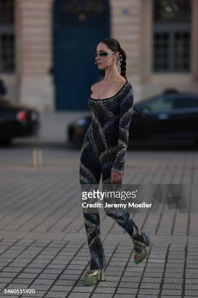 Sabina Jakubowicz seen wearing earrings Hugo Kreit, Dior sunglasses, overall with rhinestones, green platform sandals before Elie Saab show during...