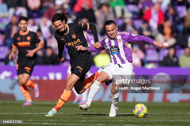 Edinson Cavani of Valencia CF battles for possession with Roque Mesa of Real Valladolid CF during the LaLiga Santander match between Real Valladolid...