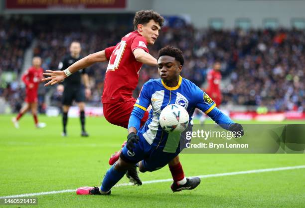 Tariq Lamptey of Brighton & Hove Albion is challenged by Stefan Bajcetic of Liverpool during the Emirates FA Cup Fourth Round match between Brighton...