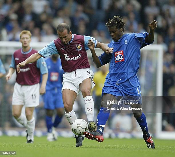 Aliou Cisse of Birmingham City tries to tackle Paolo Di Canio of West Ham United during the FA Barclaycard Premiership match between West Ham United...