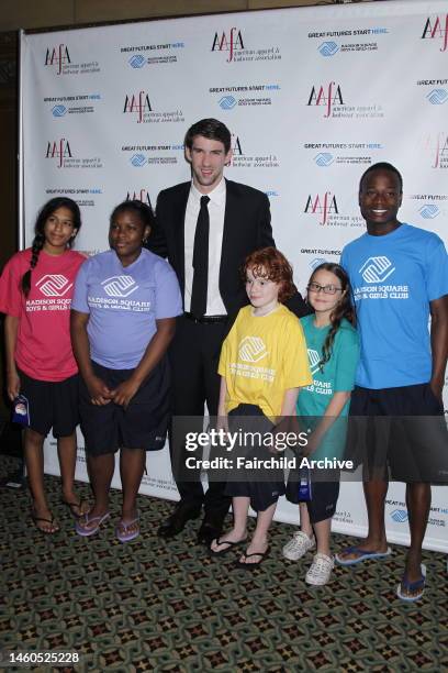 Michael Phelps with children at the American Apparel & Footwear Association's 34th annual American Image Awards at Cipriani 42nd Street. Phelps...