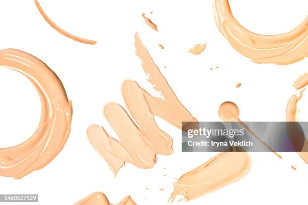 round smears of thick make-up face foundation on white background. - schminkpalette kosmetikartikel stock-fotos und bilder