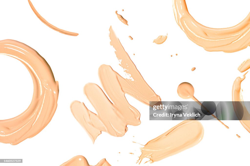 Round Smears of thick Make-up Face Foundation on white background.