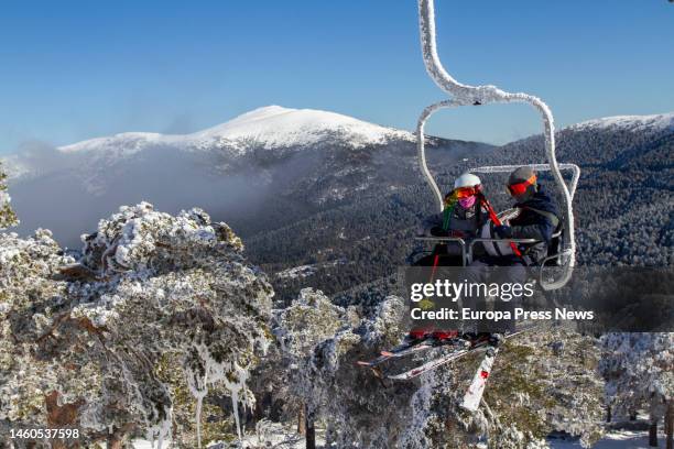 Two people ride the chairlift at the Puerto de Navacerrada ski resort, on 29 January, 2023 in Sierra de Guadarrama, Madrid, Spain. Since early...