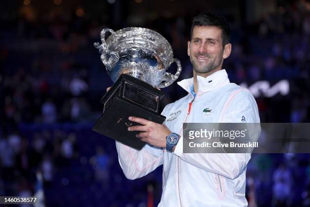 Novak Djokovic of Serbia poses for photographs with the Norman Brookes Challenge Cup after winning the Men's Singles Final match against Stefanos...