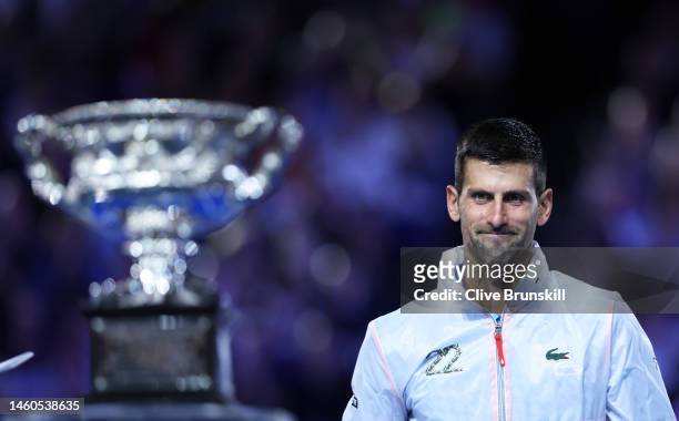 Novak Djokovic of Serbia looks on at the Norman Brookes Challenge Cup after winning the Men's Singles Final match against Stefanos Tsitsipas of...