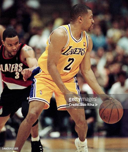Trailblazers Damon Stoudamire moves in on Lakers Derek Fisher during Game 2 action during the NBA Playoff game of Los Angeles Lakers against Portland...